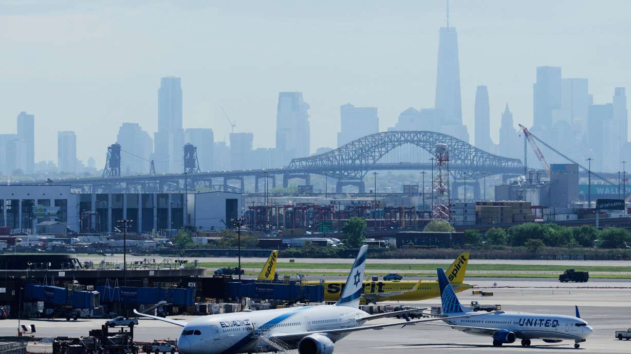 A man was detained after being accused of attacking a flight attendant and trying to get into the cockpit on a flight as it landed at Newark Liberty International Airport on Saturday, authorities told CNN.