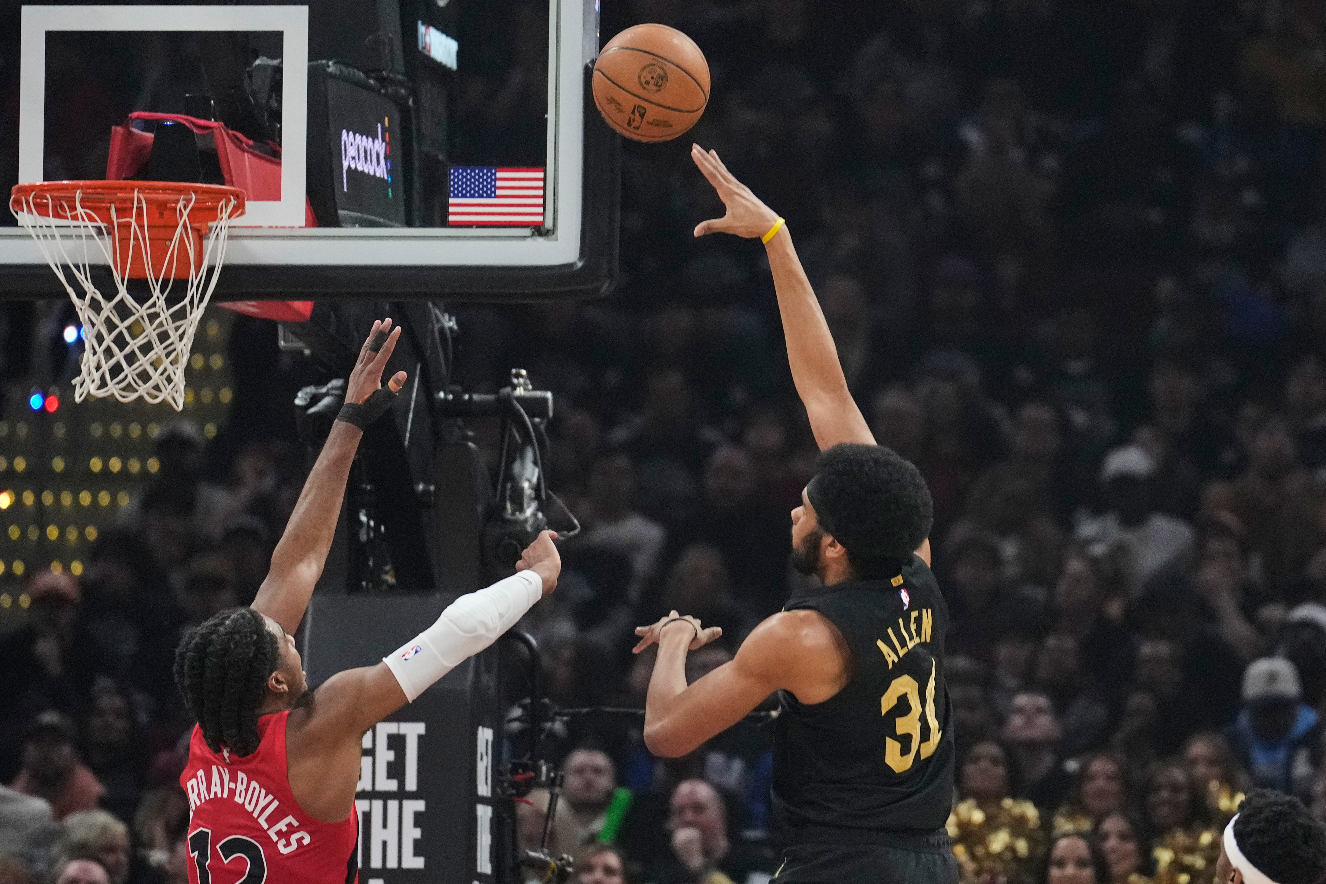 Cleveland Cavaliers center Jarrett Allen (31) shoots next to Toronto Raptors forward Collin Murray-Boyles (12) in the first half in Game 7 of a first-round NBA basketball playoffs series in Cleveland, Sunday, May 3, 2026.