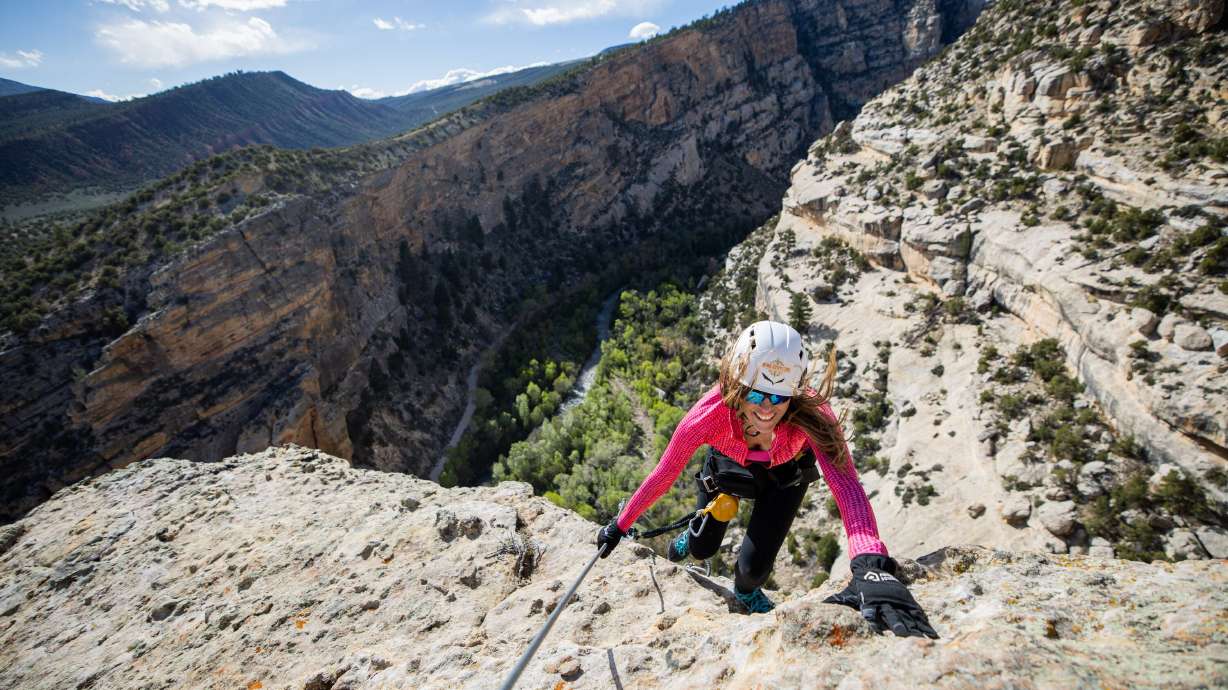 Carolyn Jane Norris, from Vernal, climbs the final section to reach the top of the Ashley Gorge Via Ferrata, Utah's first public via ferrata and the longest in the United States, offering a "hard-iron" climbing experience with steel rungs, cables and bridges, in Vernal on April 22.