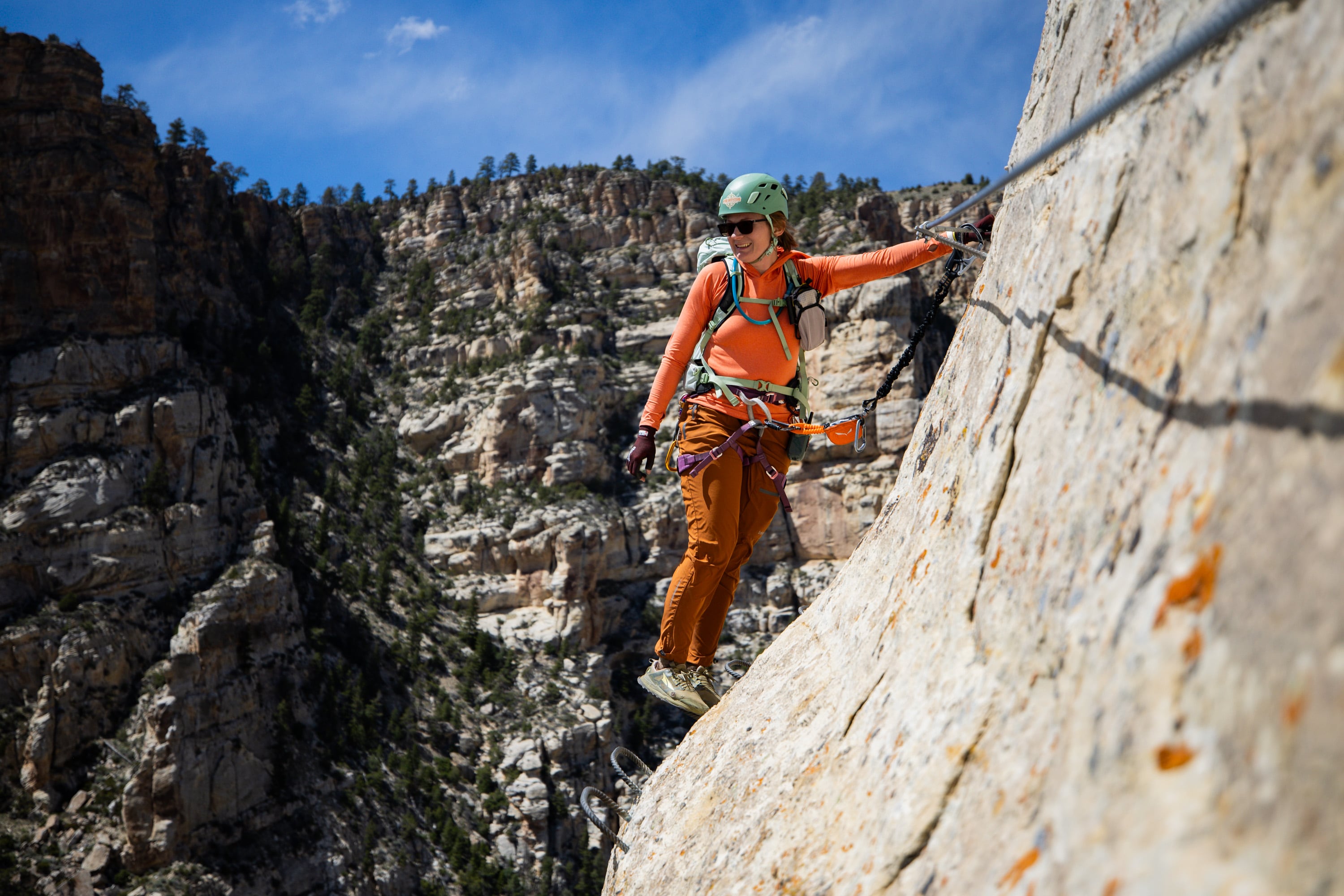 Guide and owner of Dyno Outfitters Amber Toler climbs the Ashley Gorge Via Ferrata, Utah's first public via ferrata and the longest in the United States, offering a "hard-iron" climbing experience with steel rungs, cables and bridges, in Vernal on April 22.