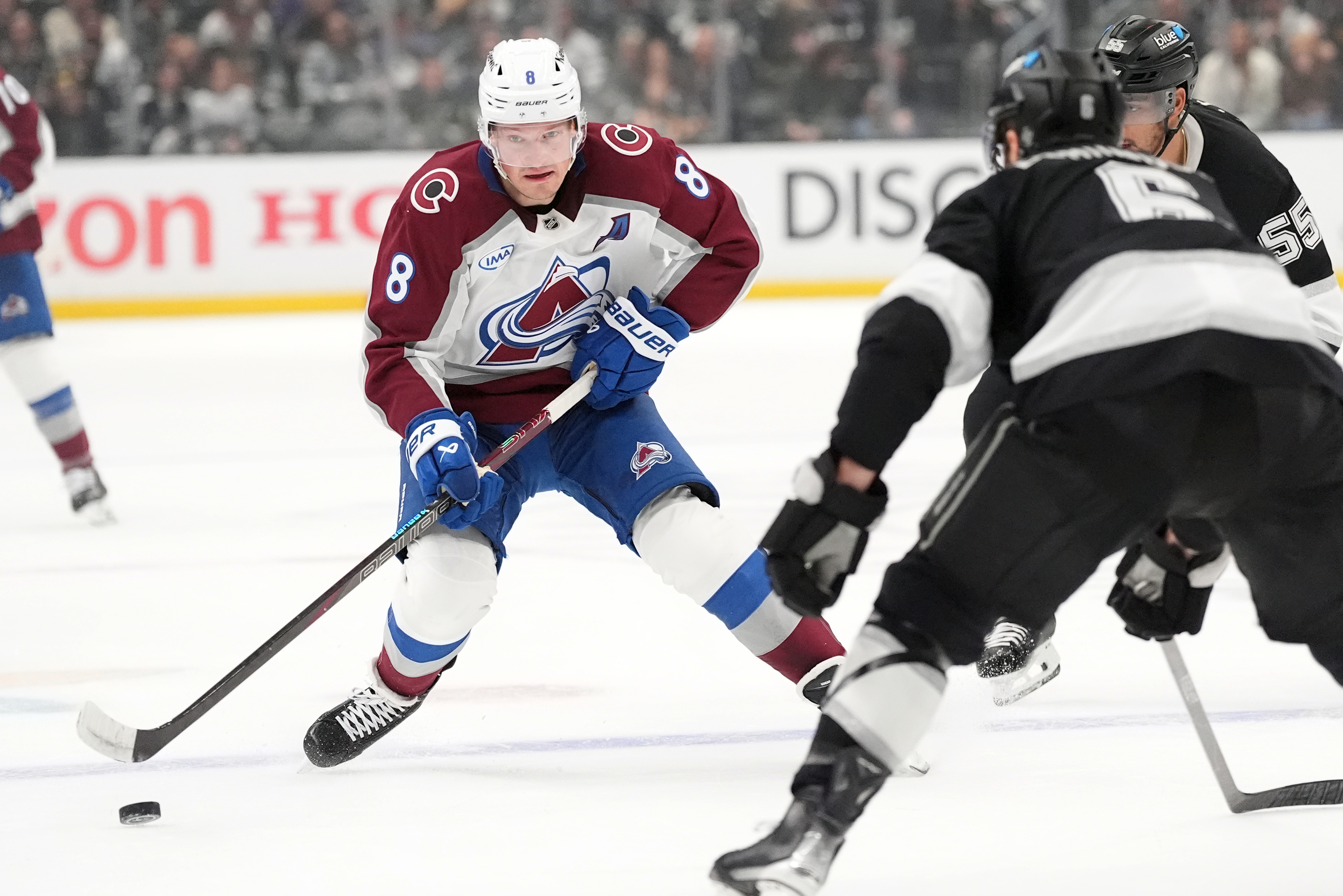 Colorado Avalanche's Cale Makar (8) brings the puck across the blue line against Los Angeles Kings during the first period of Game 4 in the first round of an NHL hockey Stanley Cup playoff series Sunday, April 26, 2026, in Los Angeles. 