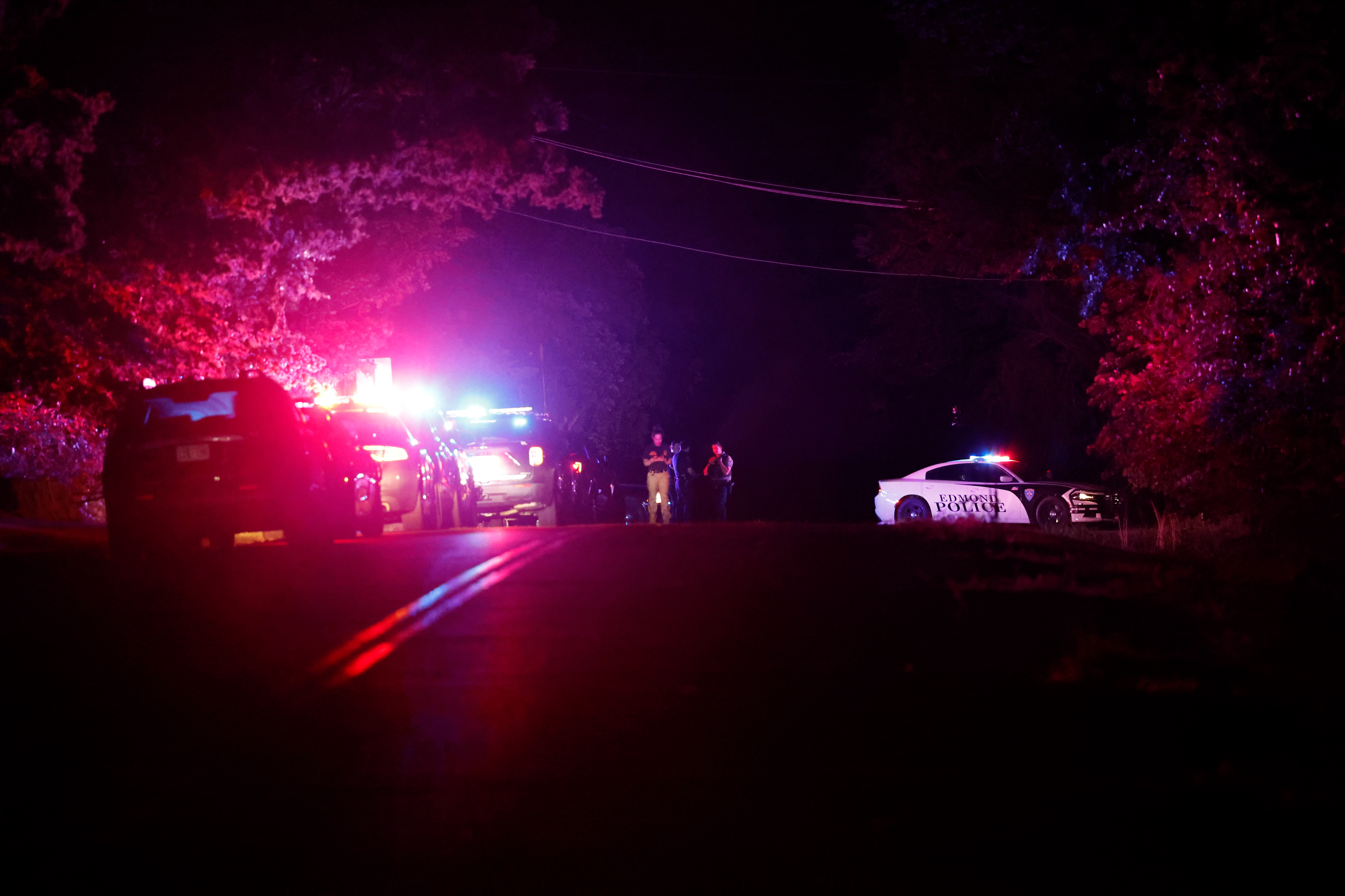 Police block off near South Air Depot Blvd. in Edmond, Okla., after a campground shooting at Lake Arcadia, Sunday.