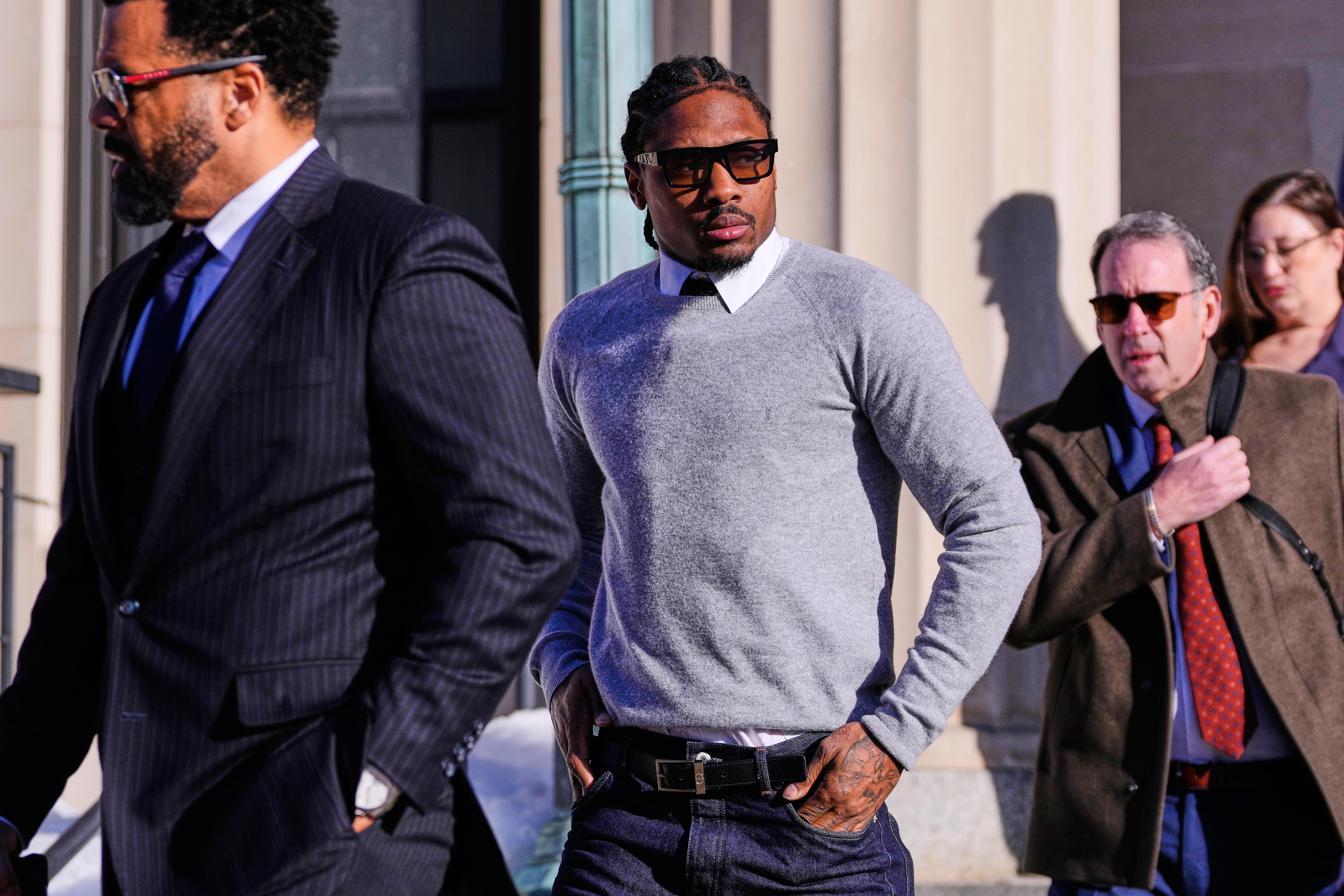 FILE - New England Patriots wide receiver Stefon Diggs leaves Norfolk County District Court after his arraignment on felony strangulation and a misdemeanor assault charges, Feb. 13, 2026, in Dedham, Mass.
