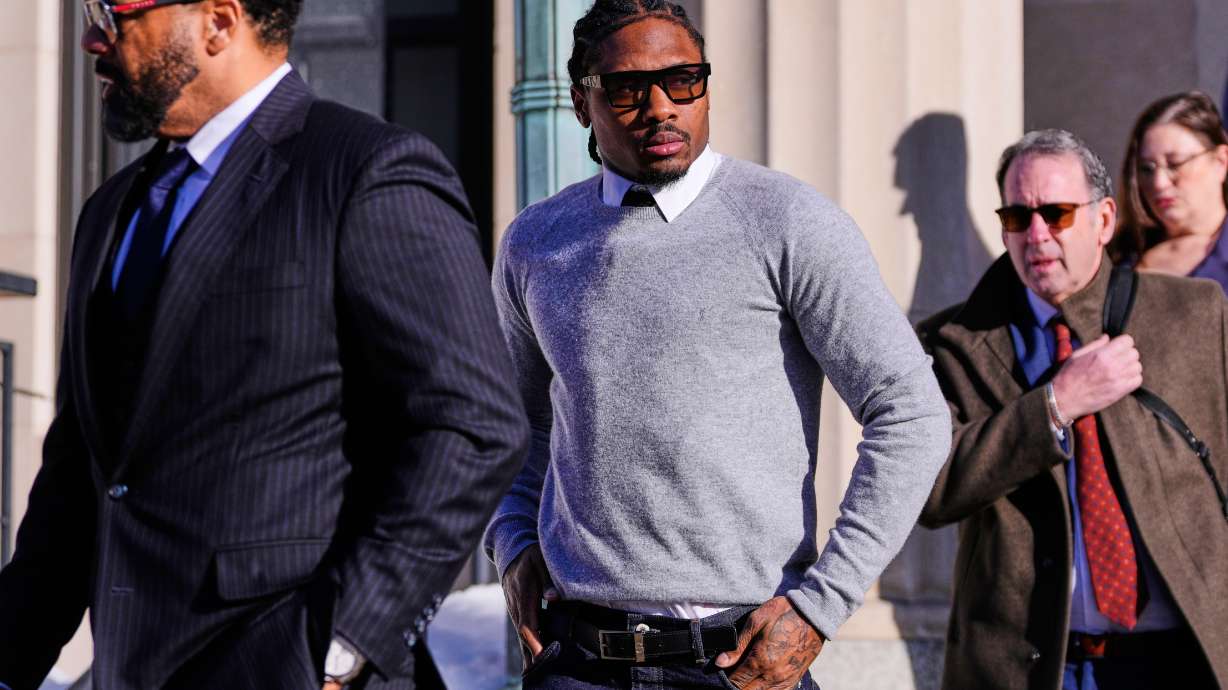 FILE - New England Patriots wide receiver Stefon Diggs leaves Norfolk County District Court after his arraignment on felony strangulation and a misdemeanor assault charges, Feb. 13, 2026, in Dedham, Mass.