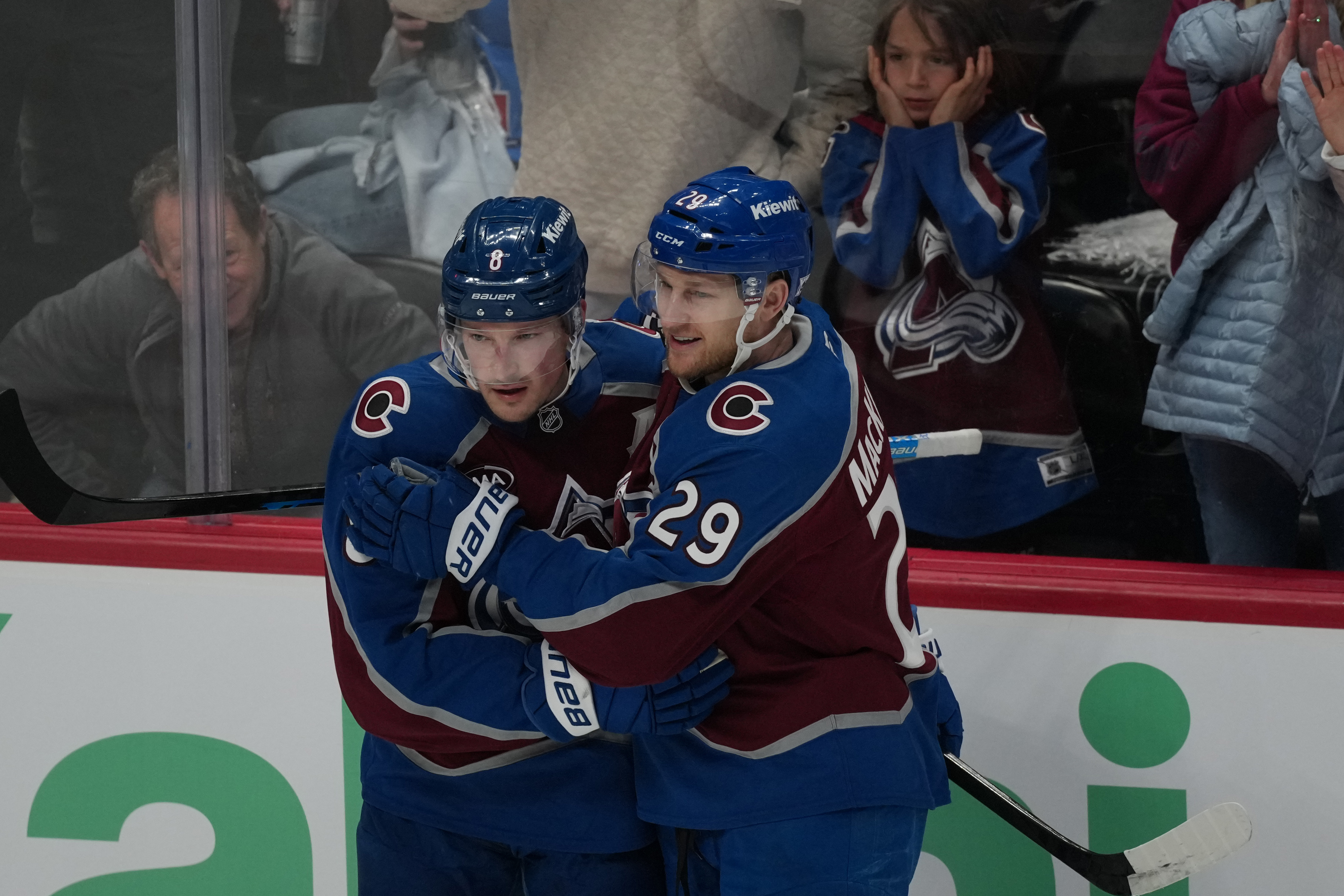 Colorado Avalanche defenseman Cale Makar, left, congratulates center Nathan MacKinnon after he scored a goal against the Minnesota Wild in the third period of Game 1 of an NHL hockey Stanley Cup second-round playoff series Sunday, May 3, 2026, in Denver. 