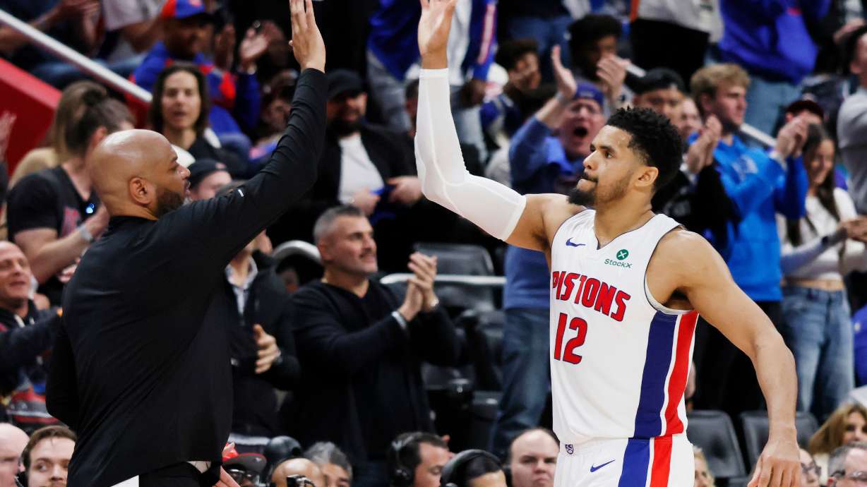 Detroit Pistons forward Tobias Harris (12) celebrates with head coach J.B. Bickerstaff, left, as he leaves late in the fourth quarter of a win over the Orlando Magic in Game 7 of a first-round NBA basketball playoffs series Tuesday, May 2, 2026, in Detroit.