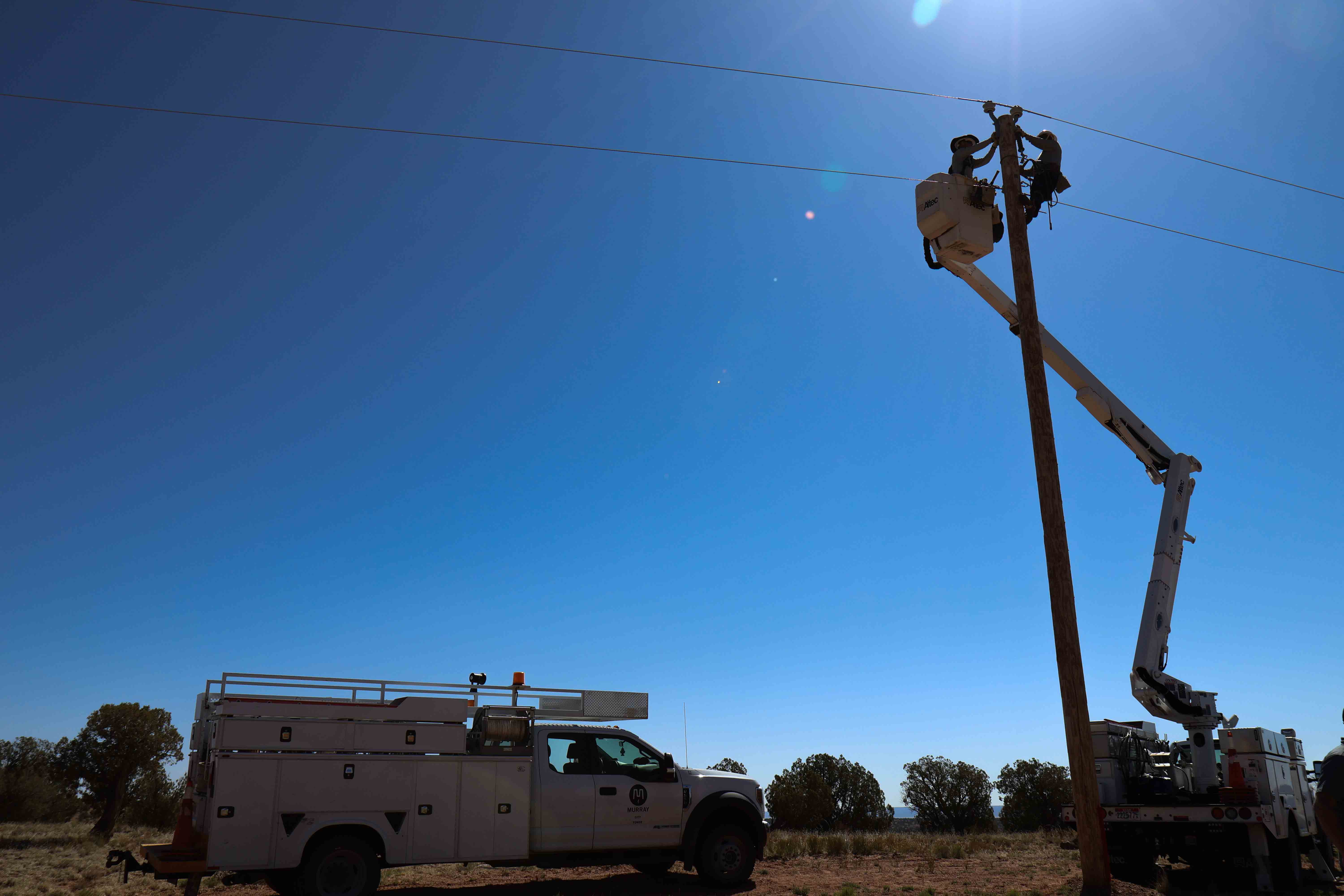 A Murray City power crew during electrification efforts as part of the Light Up Navajo initiative in April.