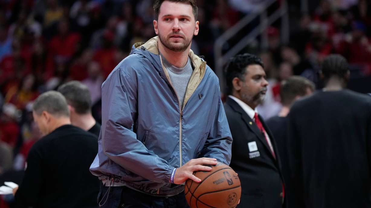Los Angeles Lakers guard Luka Doncic holds a ball during a timeout in the first half of Game 6 of a first-round NBA playoffs basketball series against the Houston Rockets in Houston, Friday, May 1, 2026.
