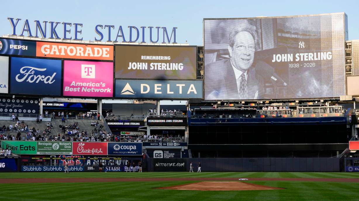 A scoreboard displays late former New York Yankees broadcaster John Sterling during a tribute to Sterling ahead of a baseball game between the New York Yankees and the Baltimore Orioles, Monday, May 4, 2026, in New York.