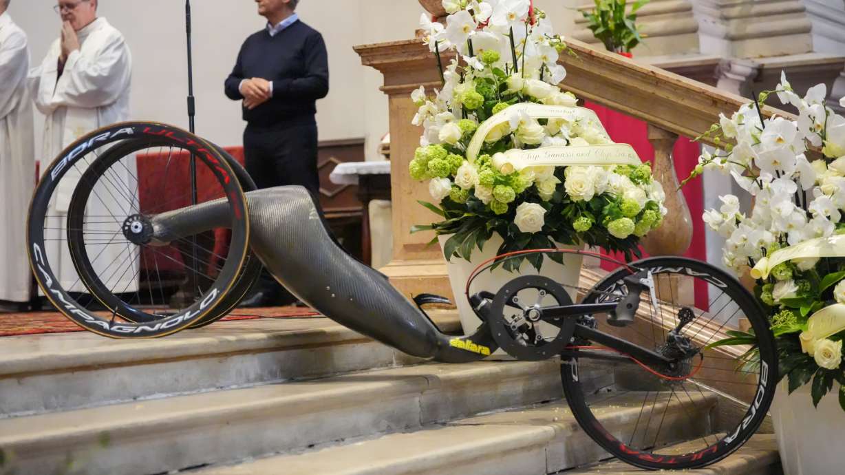 The handbike of Alex Zanardi, Italian auto racing champion-turned-Paralympic gold medalist, is displayed near the alter during his funeral inside the Basilica of Santa Giustina, Padua, Italy, Tuesday, May 5, 2026.