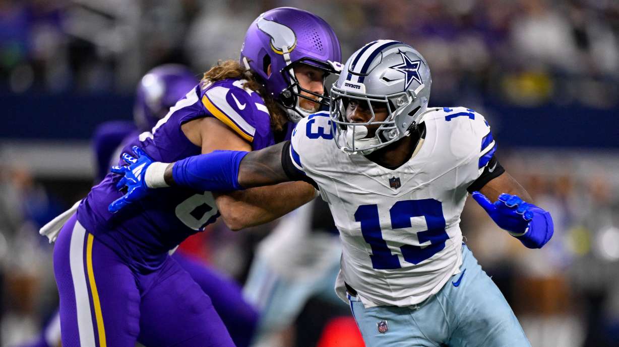 FILE - Dallas Cowboys defensive end Dante Fowler Jr. (13) rushes the line past Minnesota Vikings tight end T.J. Hockenson (87) during an NFL football game between the Dallas Cowboys and the Minnesota Vikings on Dec. 14, 2025, in Arlington, Texas.