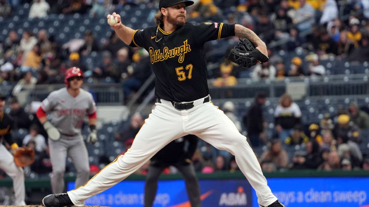 FILE - Pittsburgh Pirates pitcher Chris Devenski deliver a pitch against the Cincinnati Reds in the sixth inning of a baseball game in Pittsburgh, Saturday, May 2, 2026.