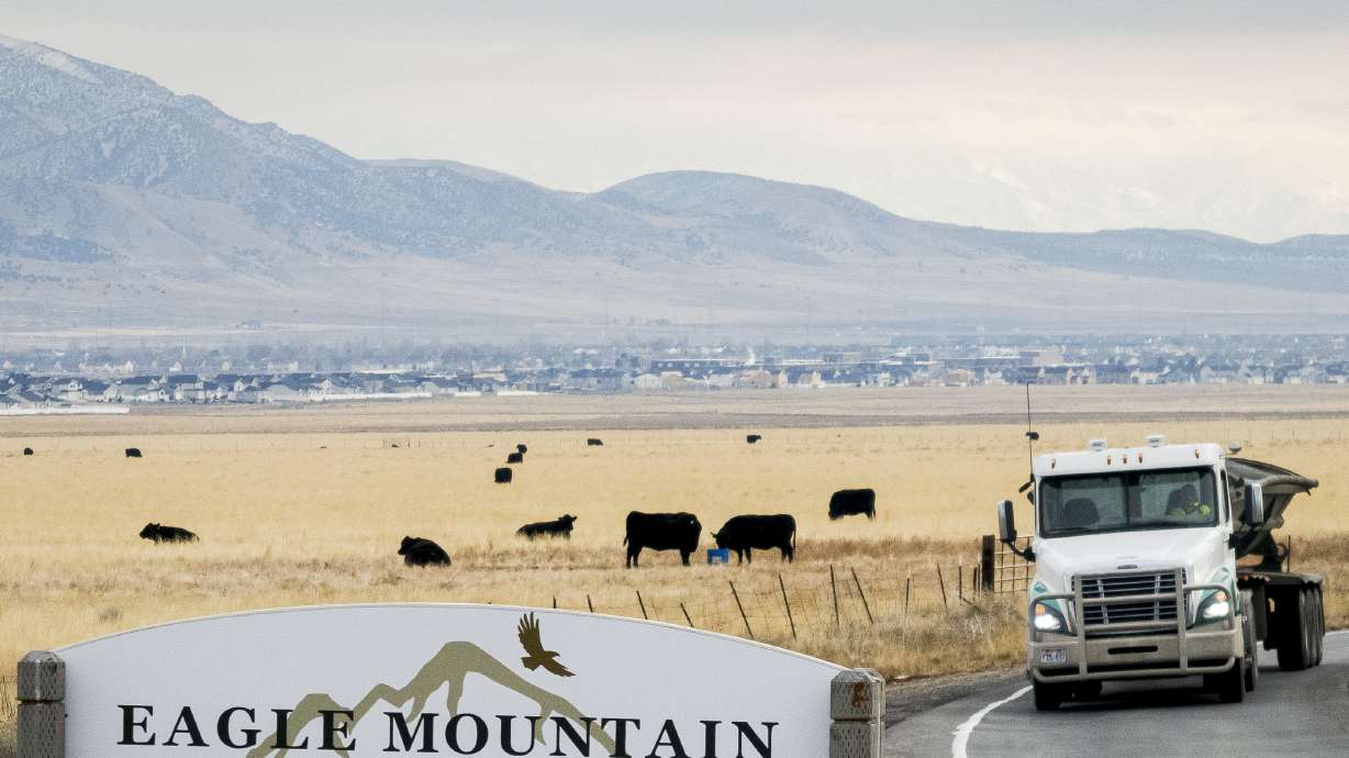Traffic flows along Eagle Mountain Boulevard in Eagle Mountain on Jan. 14, 2025. Lake Mountain School District approved the acquisition of a 100-acre site in Eagle Mountain to develop a joint campus with Mountainland Technical College and UVU.