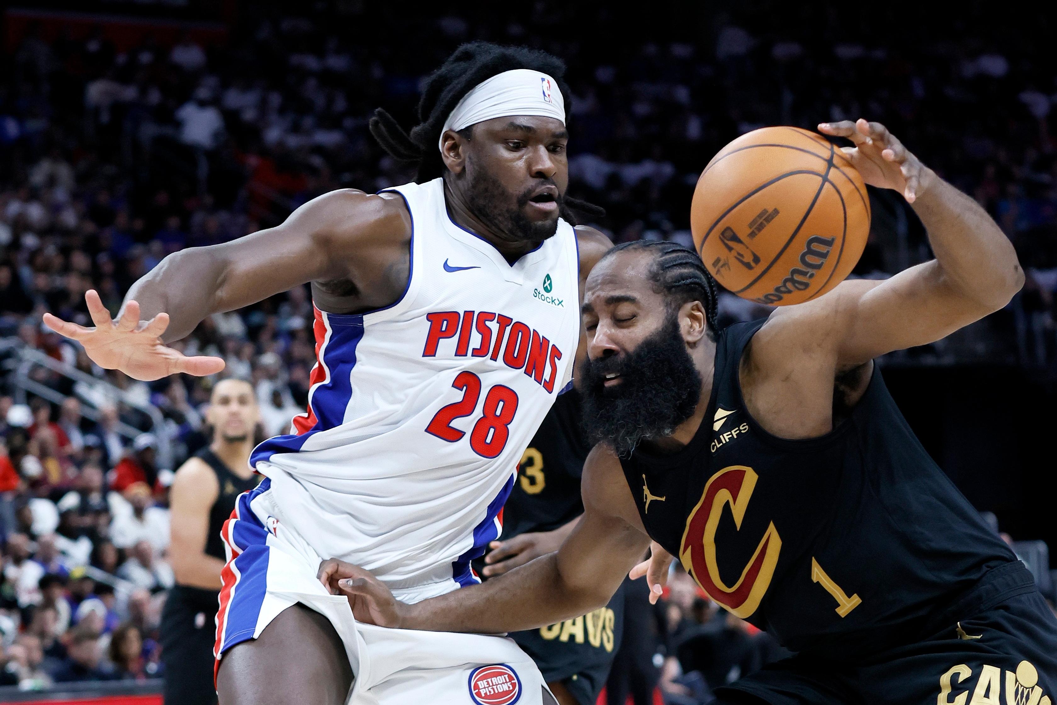 Cleveland Cavaliers guard James Harden (1) drives against Detroit Pistons forward Isaiah Stewart (28) during the first half in Game 1 of a second-round NBA playoffs basketball series Tuesday, May 5, 2026, in Detroit. 