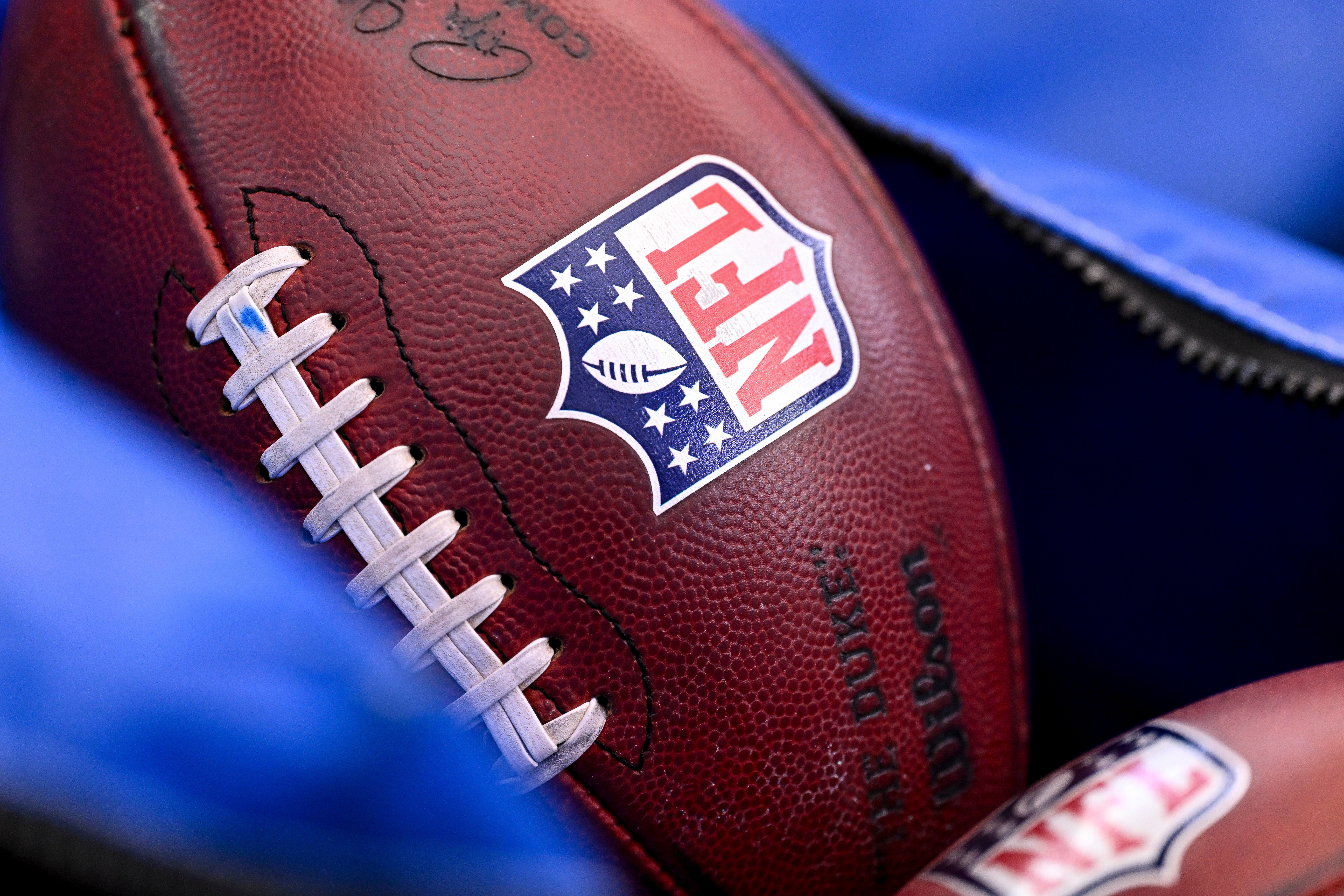 FILE - A detail view of the NFL shield on a football prior to an NFL football game between the Houston Texans and the Indianapolis Colts on Jan. 4, 2026, in Houston. 