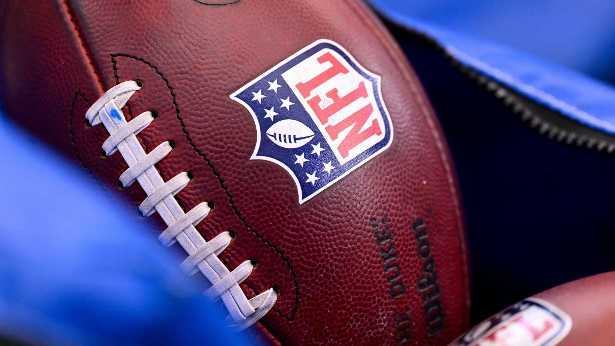 FILE - A detail view of the NFL shield on a football prior to an NFL football game between the Houston Texans and the Indianapolis Colts on Jan. 4, 2026, in Houston.