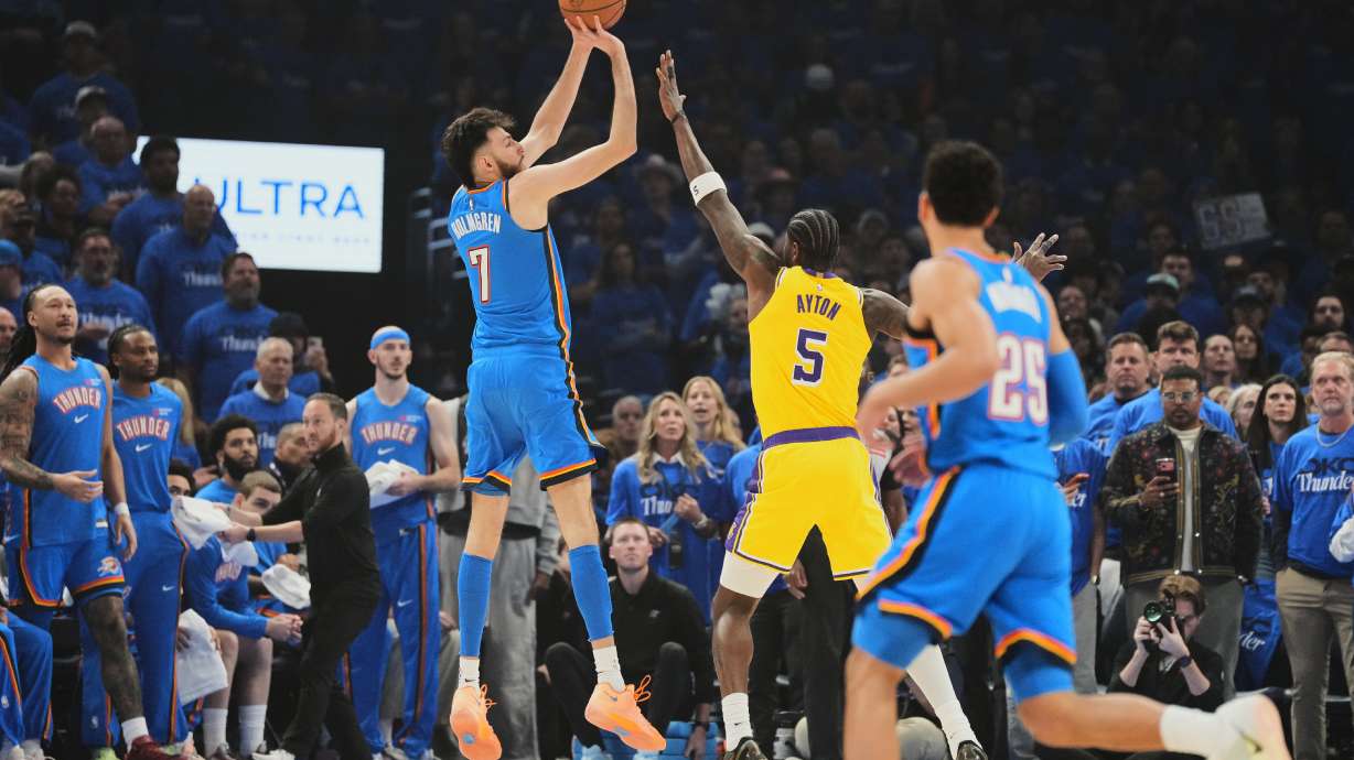 Oklahoma City Thunder center Chet Holmgren (7) shoots over Los Angeles Lakers center Deandre Ayton (5) as Ajay Mitchell (25) looks on in the first half of Game 1 in a second-round NBA basketball playoffs series Tuesday, May 5, 2026 in Oklahoma City.
