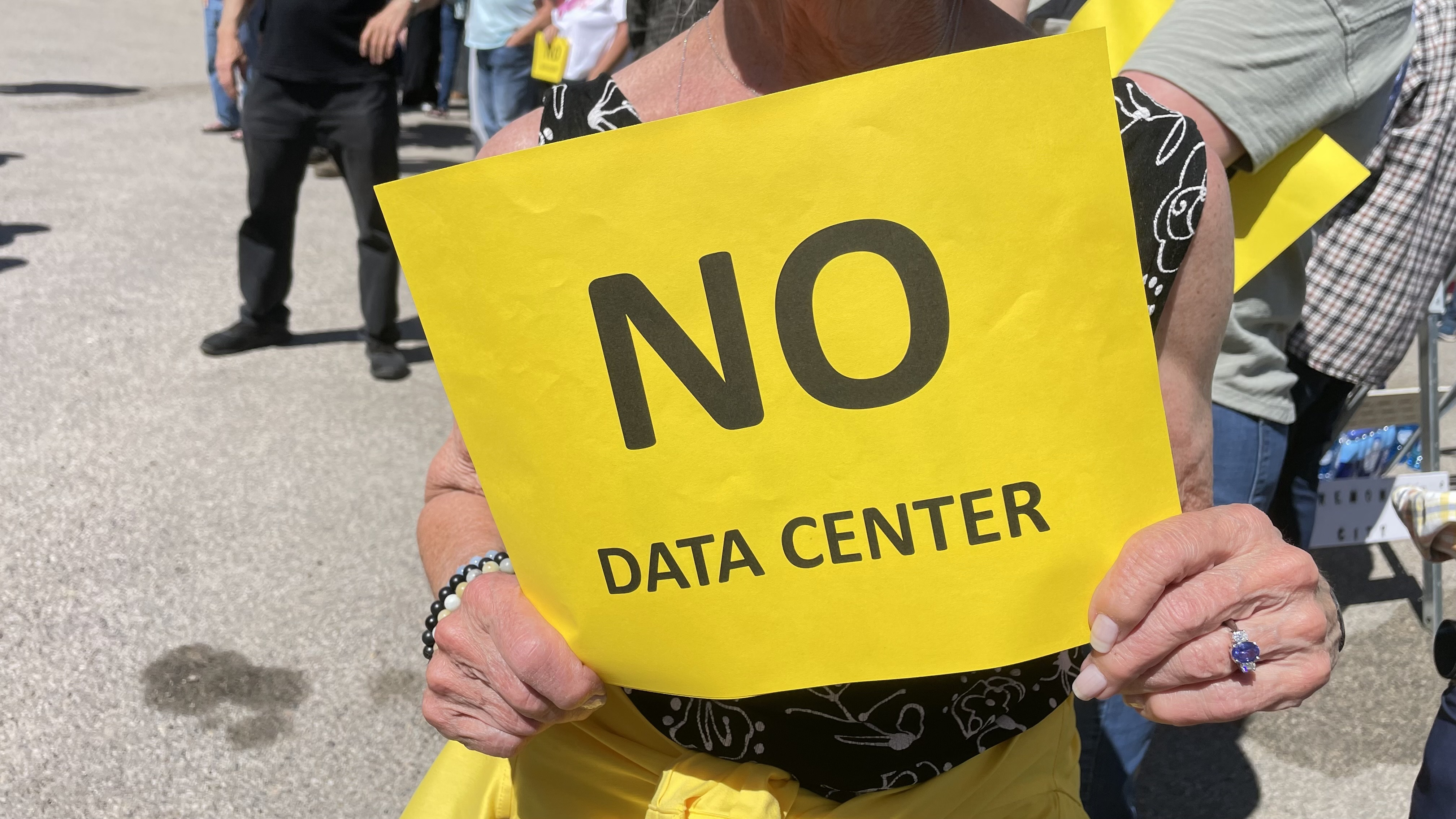 Box Elder County commissioners met Monday at the Box Elder County Fairgrounds in Tremonton to consider a controversial data center proposal. The photo shows one of hundreds of protesters against the project.