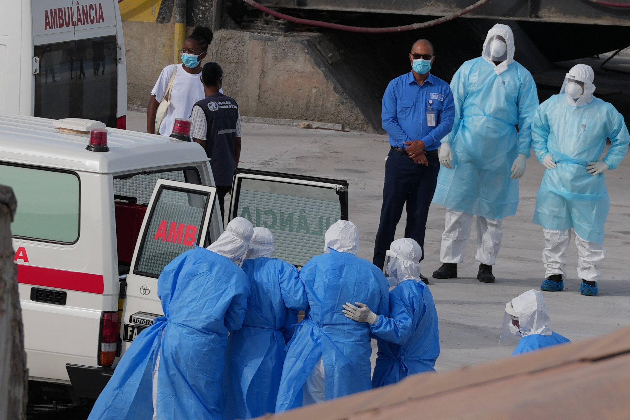Health workers in protective gear evacuate patients from the MV Hondius cruise ship into an ambulance at a port in Praia, Cape Verde, Wednesday.
