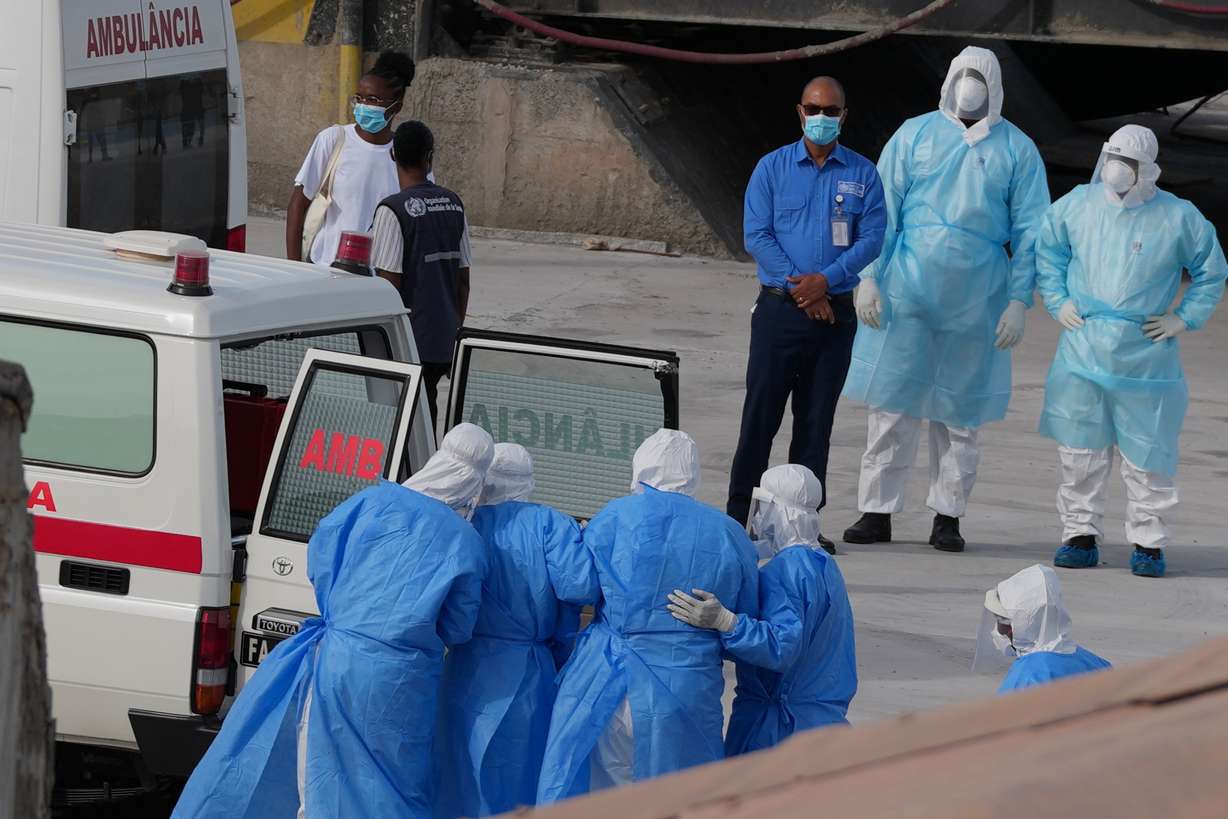 Health workers in protective gear evacuate patients from the MV Hondius cruise ship into an ambulance at a port in Praia, Cape Verde, Wednesday.