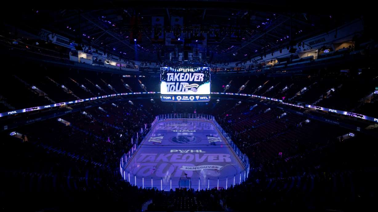 FILE - Fans gather to watch the Montreal Victoire and the Toronto Sceptres warm up before a PWHL hockey game in Vancouver, Jan. 8, 2025.