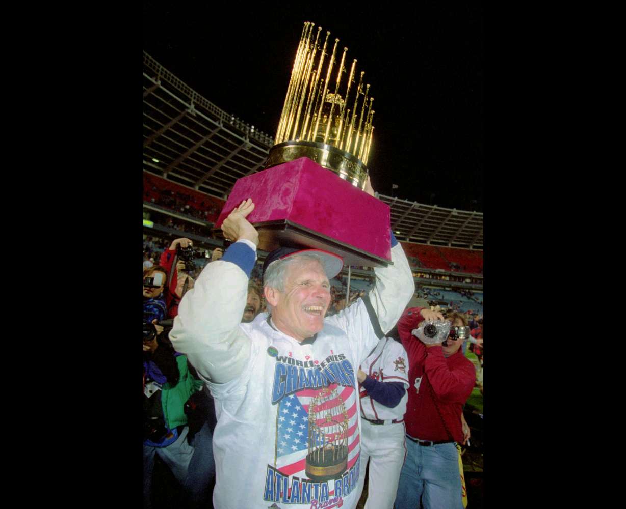 Atlanta Braves owner Ted Turner holds up the World Series trophy on the field at Atlanta Fulton County Stadium after the Braves won the 1995 World Series, Oct. 28, 1995, in Atlanta.