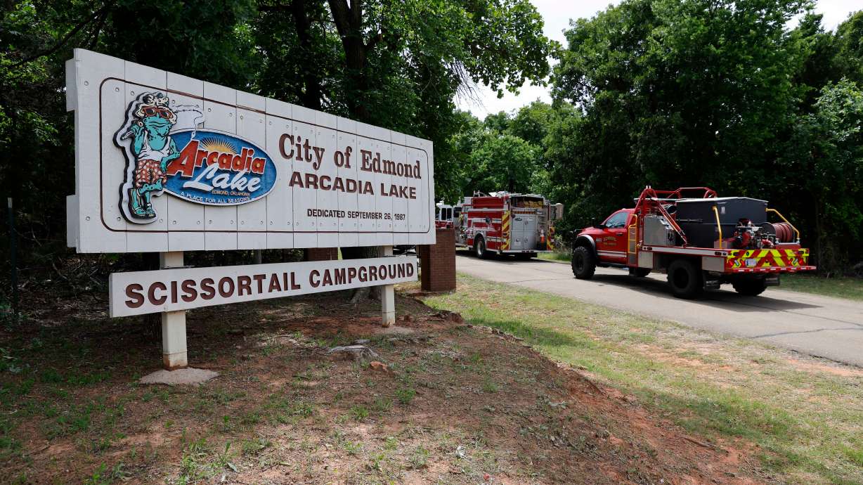 Edmond fire crews enter Scissortail Campground at Arcadia Lake in Edmond, Okla. on Monday after a party shooting on Sunday evening. An 18-year-old man has been arrested in connection with the shooting, police said on Wednesday.