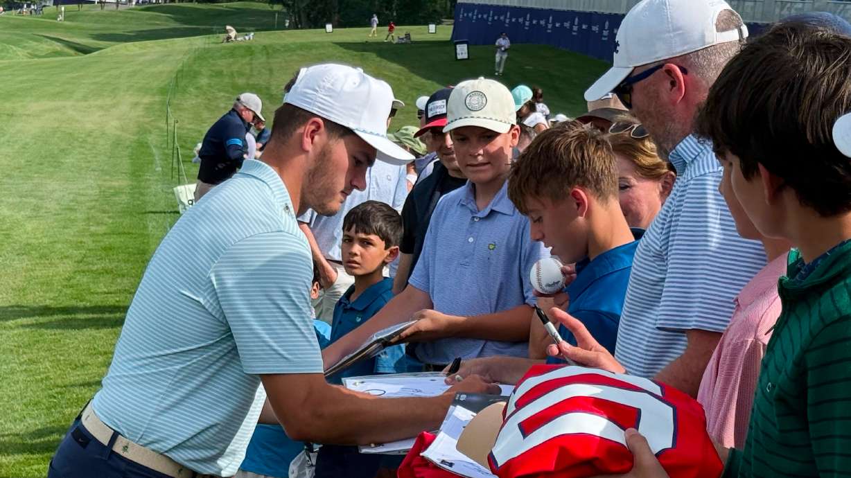 New England Patriots quarterback Drake Maye signs autographs for fans after the pro-am at the Trust Championship golf tournament, Wednesday, May 6, 2026, at Quail Hollow Club in Charlotte.