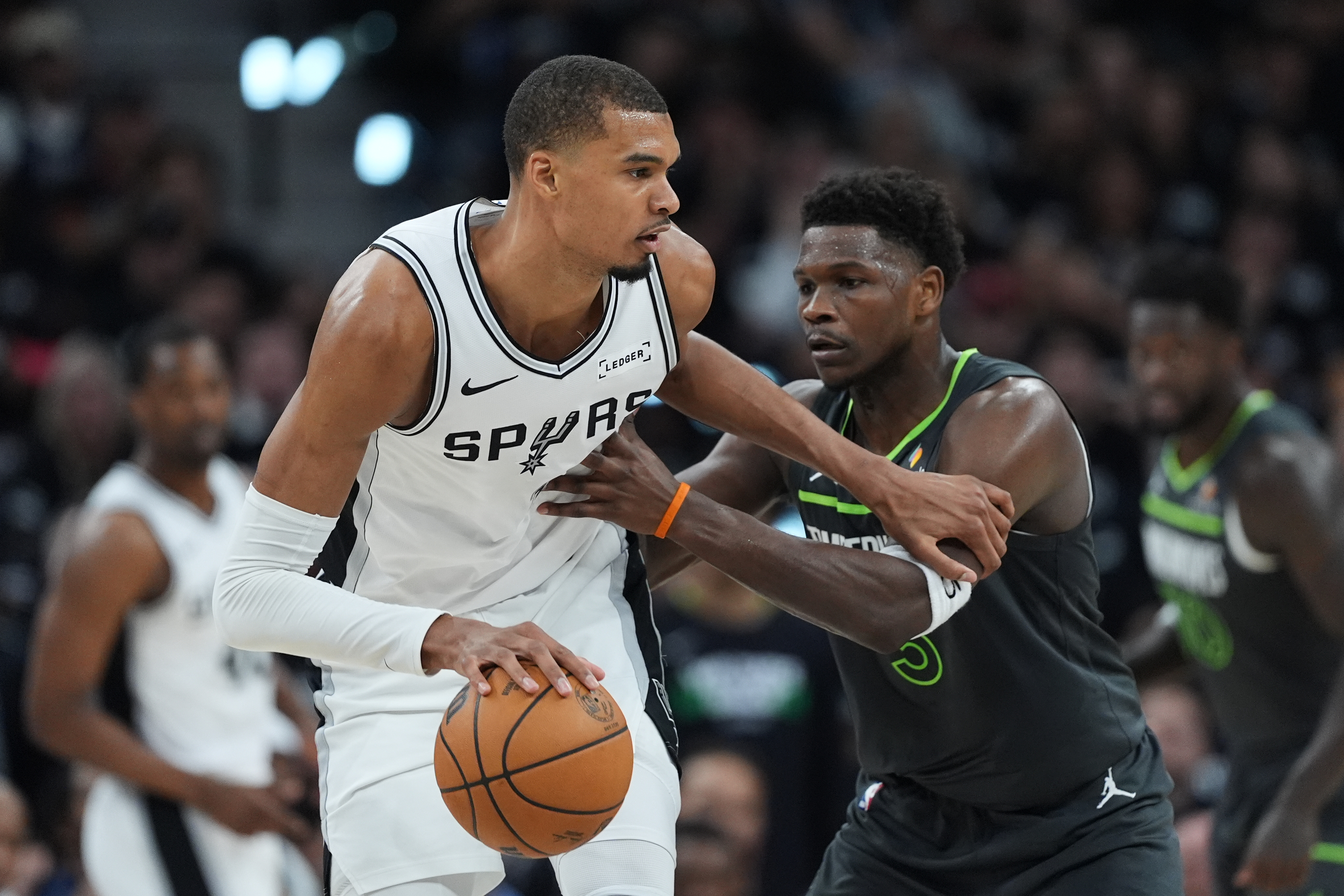 San Antonio Spurs forward Victor Wembanyama (1) drives against Minnesota Timberwolves guard Anthony Edwards (5) during the first half in Game 2 of a second-round NBA playoffs basketball series in San Antonio, Wednesday, May 6, 2026. 