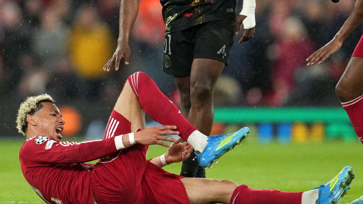 Liverpool's Hugo Ekitike reacts after getting injured during the Champions League quarterfinal second leg soccer match between Liverpool and Paris Saint-Germain in Liverpool, England, Tuesday, April 14, 2026.