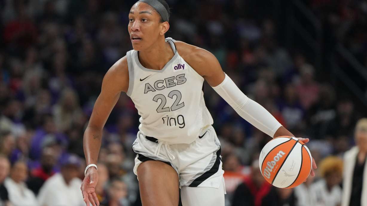 FILE - Las Vegas Aces center A'ja Wilson (22) dribbles against the Phoenix Mercury during the first half of Game 4 of the WNBA basketball finals, Friday, Oct. 10, 2025, in Phoenix.