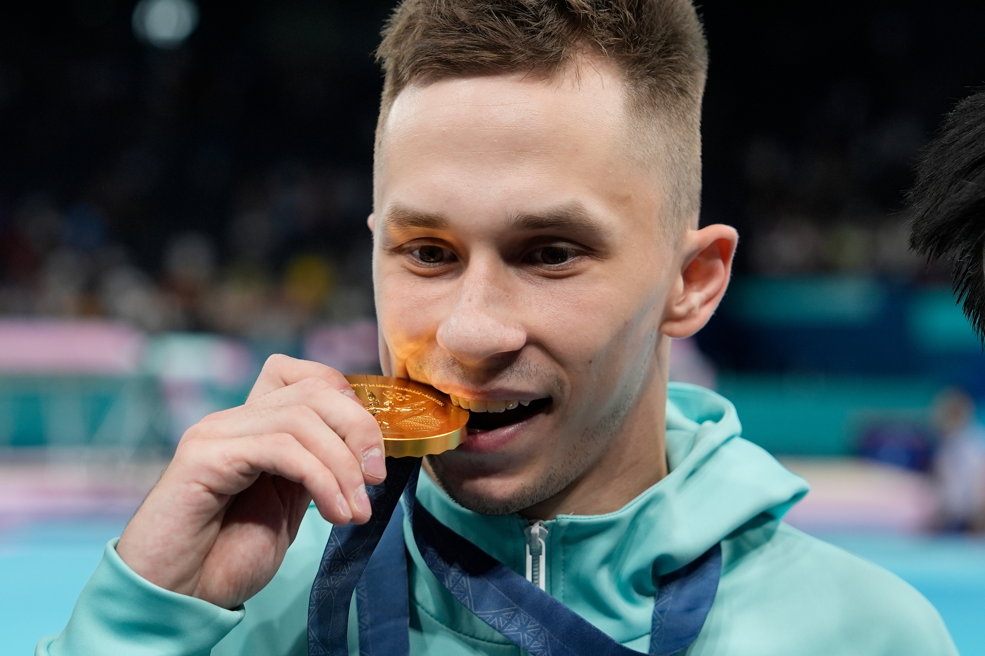 FILE - Ivan Litvinovich of the Individual Neutral Athletes celebrates after winning the gold medal during the men's trampoline finals in Bercy Arena at the 2024 Summer Olympics, Friday, Aug. 2, 2024, in Paris, France. 