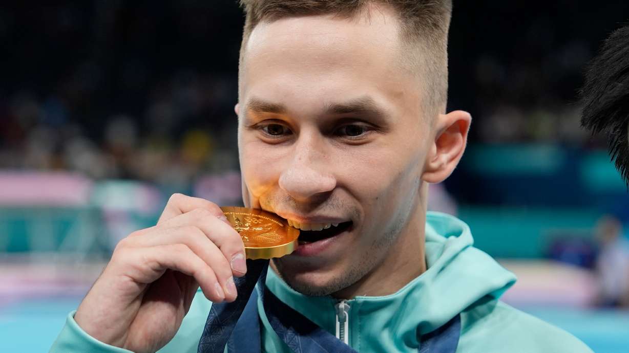 FILE - Ivan Litvinovich of the Individual Neutral Athletes celebrates after winning the gold medal during the men's trampoline finals in Bercy Arena at the 2024 Summer Olympics, Friday, Aug. 2, 2024, in Paris, France.