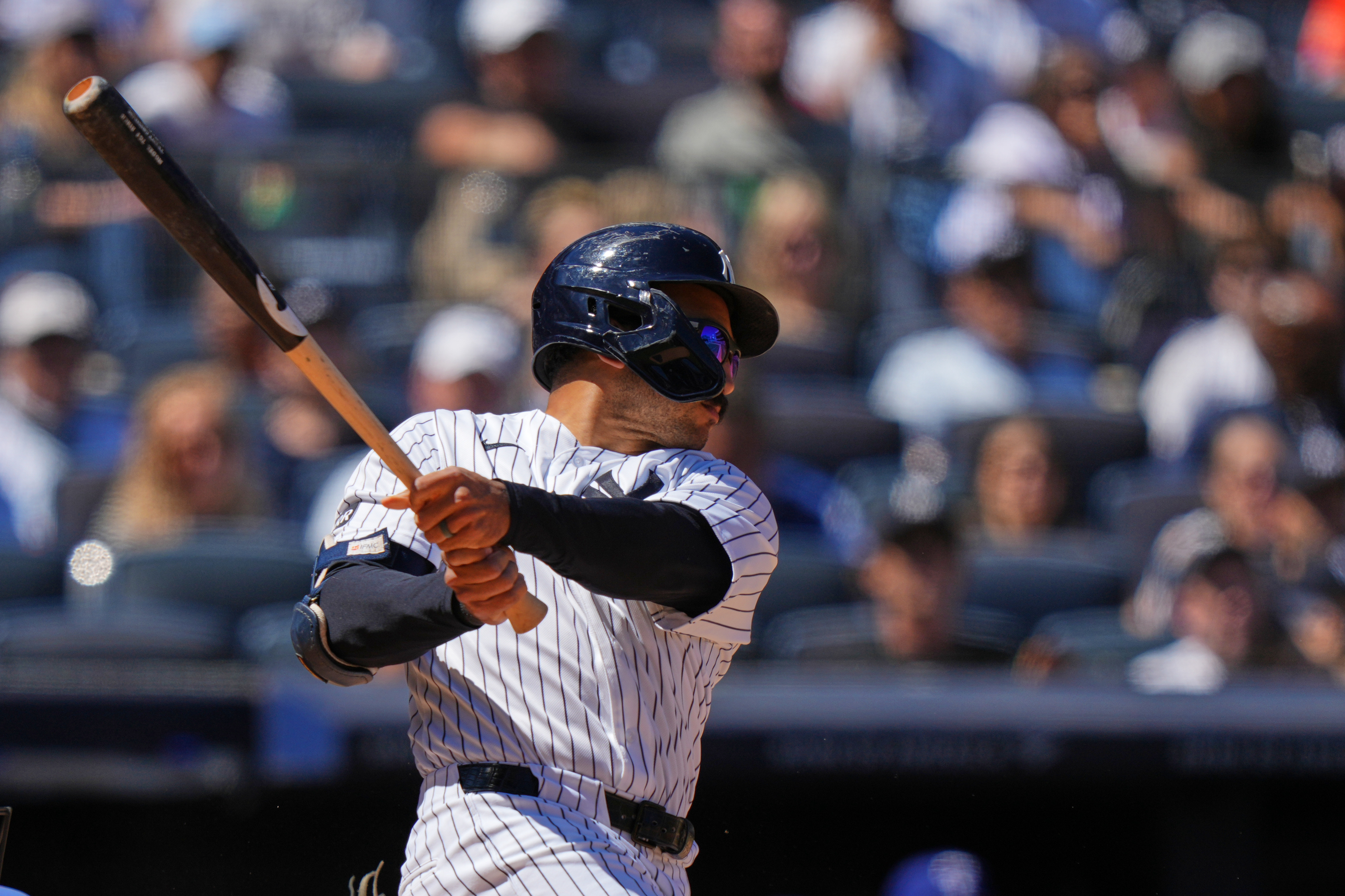 New York Yankees' Trent Grisham follows through on a three-run double during the sixth inning of a baseball game against the Texas Rangers Thursday, May 7, 2026, in New York. 