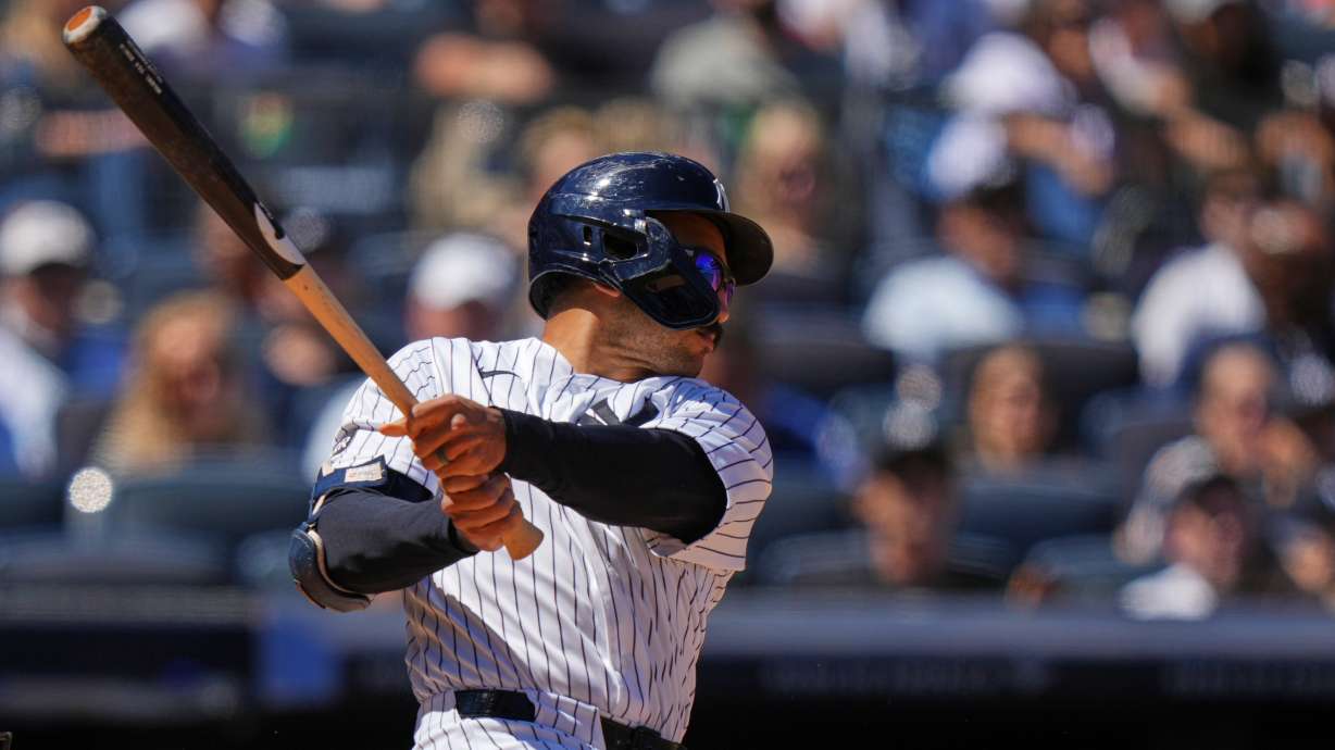 New York Yankees' Trent Grisham follows through on a three-run double during the sixth inning of a baseball game against the Texas Rangers Thursday, May 7, 2026, in New York.