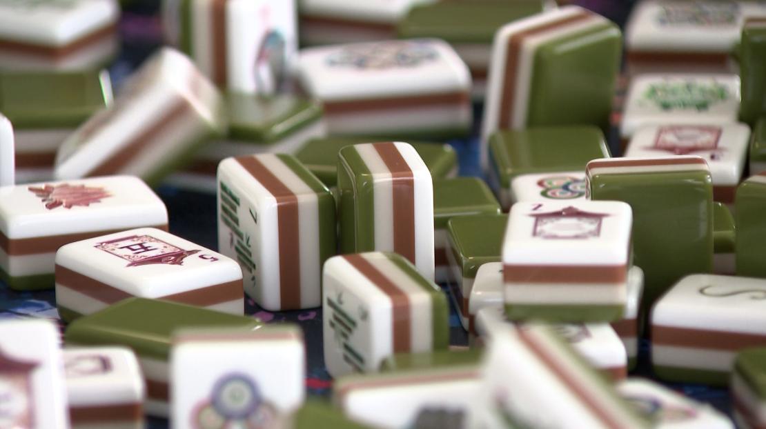 The American version of a classic Chinese game is quickly gaining traction, bringing groups of women together over the sound of clacking tiles and excited calls of "mahjong!"