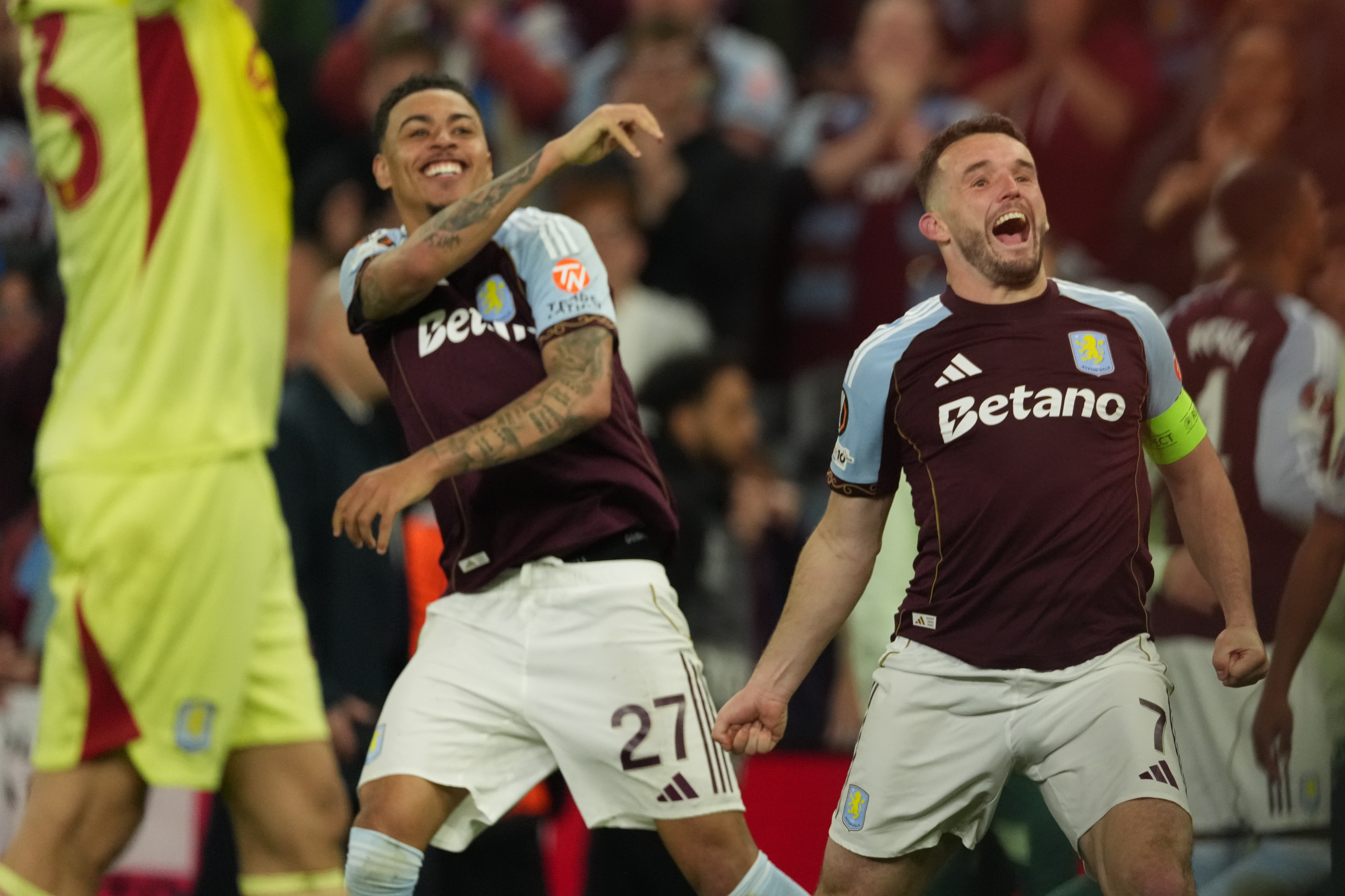 Aston Villa's John McGinn, right, and Morgan Rogers react after the Europa League second-leg semifinal soccer match between Aston Villa and Nottingham Forest in Birmingham, England, Thursday, May 7, 2026. 