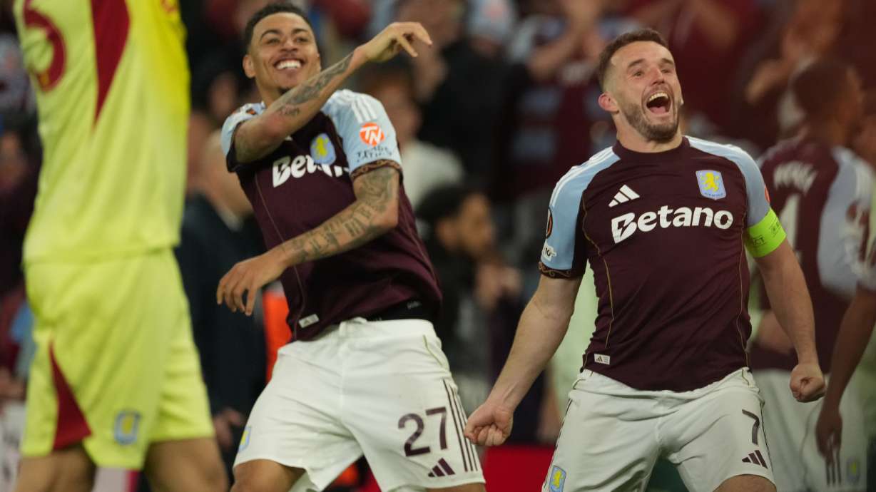 Aston Villa's John McGinn, right, and Morgan Rogers react after the Europa League second-leg semifinal soccer match between Aston Villa and Nottingham Forest in Birmingham, England, Thursday, May 7, 2026.