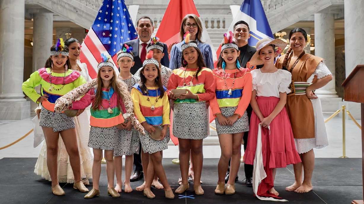 Peruvian General Consul Czibor Chicata-Sutmöller, rear left, and Lt. Gov. Deidre Henderson stand with Piero Góngora and members of his dance studio on Monday in the Utah Capitol in Salt Lake City to mark 200 years of U.S.-Peruvian relations.