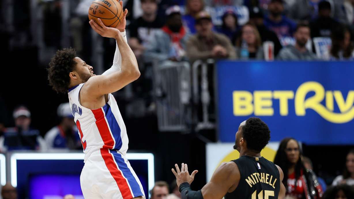 Detroit Pistons guard Cade Cunningham takes a shot against Cleveland Cavaliers guard Donovan Mitchell (45) during the first half in Game 2 of a second-round NBA playoffs basketball series, Thursday, May 7, 2026, in Detroit.