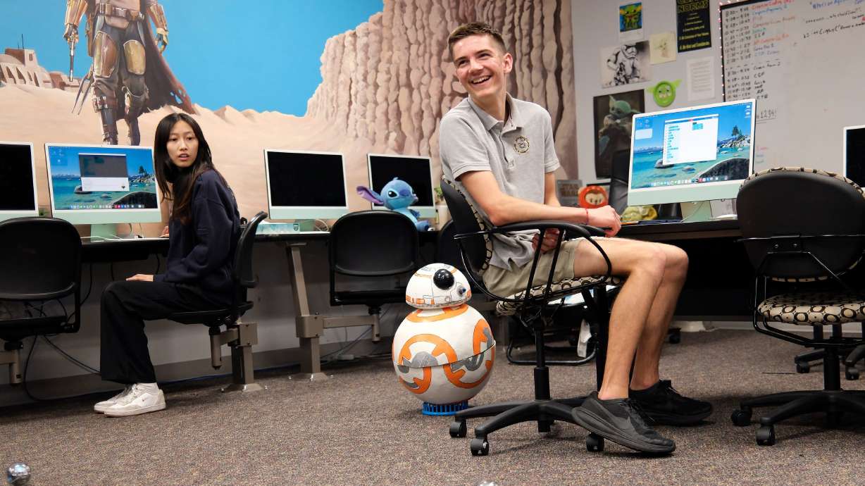 Cindy Li, high school senior, and Oskar Kapitonov, high school sophomore, react as they work to control Sphero bolt robots during Career and Technical Education at Beehive Science and Technology Academy in Sandy on Thursday.