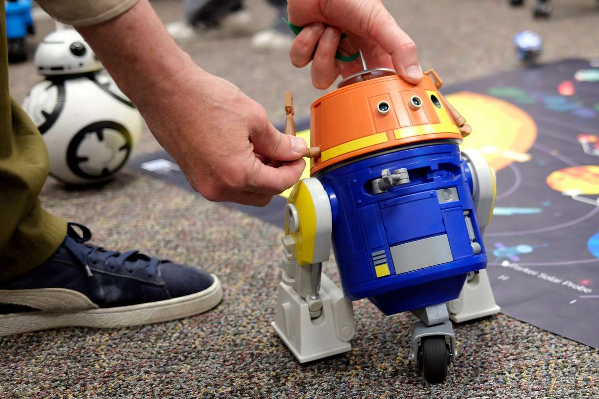 Mark Hutter adjusts a robot while teaching Career and Technical Education at Beehive Science and Technology Academy in Sandy on Thursday.