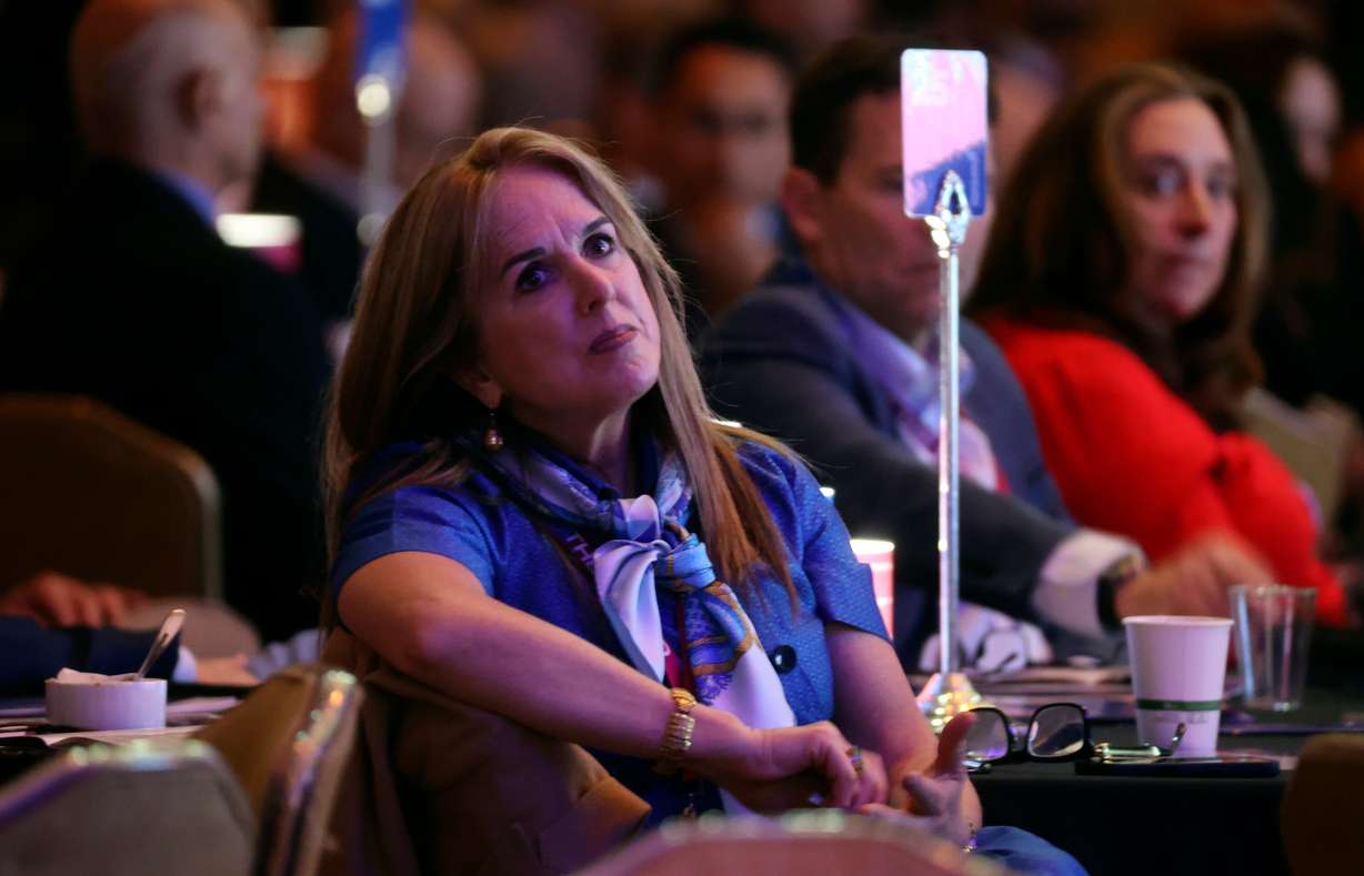 A woman listens during the Crossroads of the World International Trade Summit at Grand America on Thursday. Former Trade representative Robert Lighthizer criticized the current global trade system in his speech at the event.