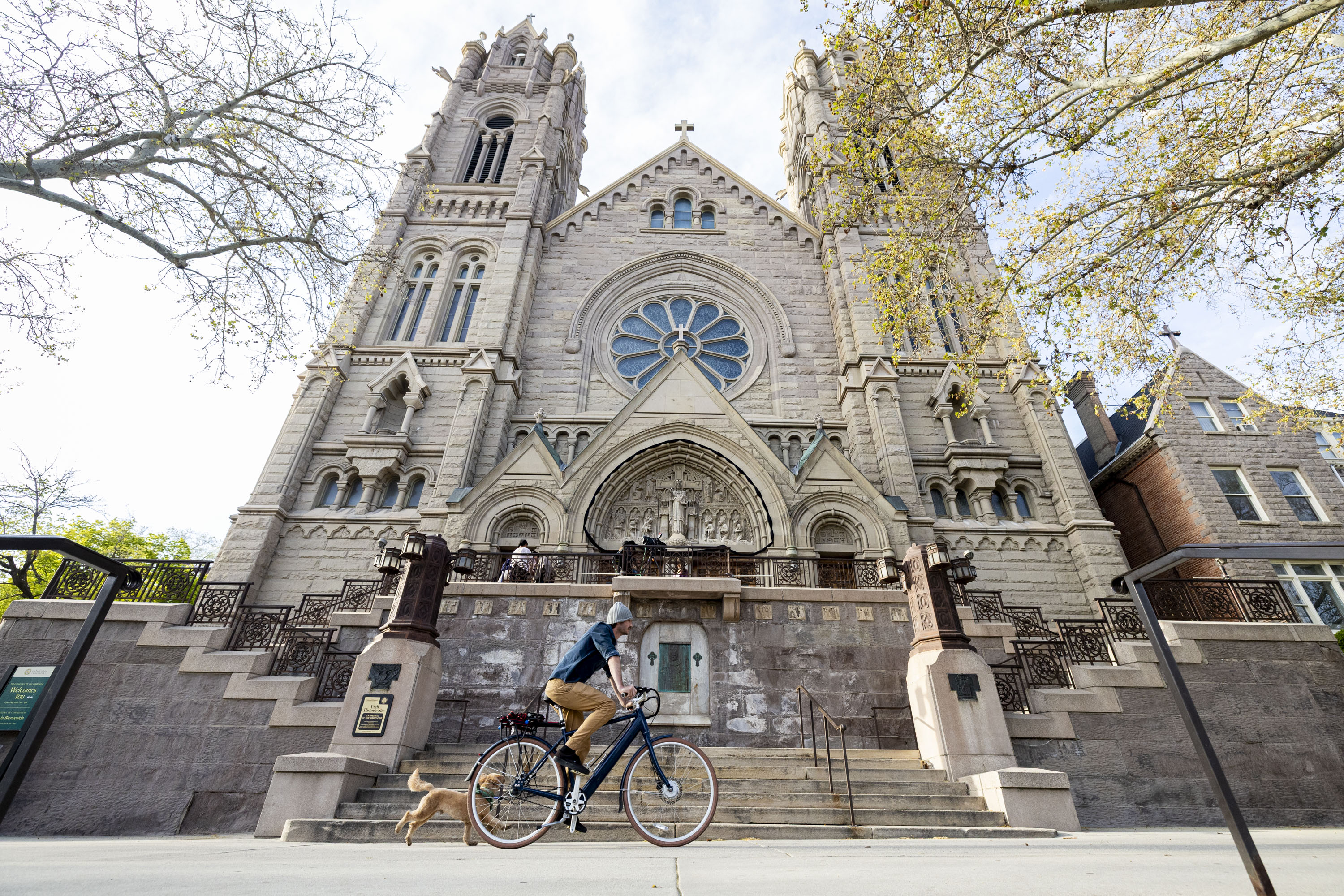 A cyclist rides past the Cathedral of the Madeleine in Salt Lake City on April 22, 2025. The Madeleine School Choir is performing "Noah's Flood" at the cathedral this weekend.