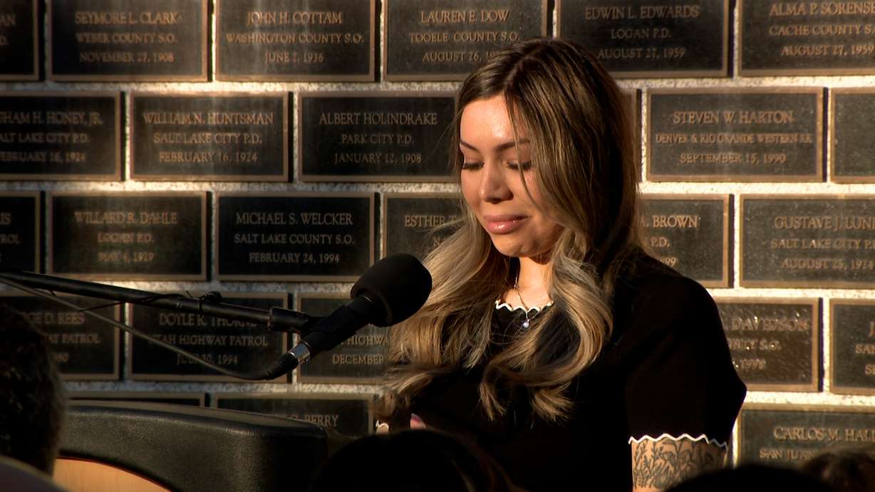 Brittney Estrada speaks at the Utah Law Enforcement Memorial on Thursday. Her husband, Eric Estrada, had his name added to the memorial.
