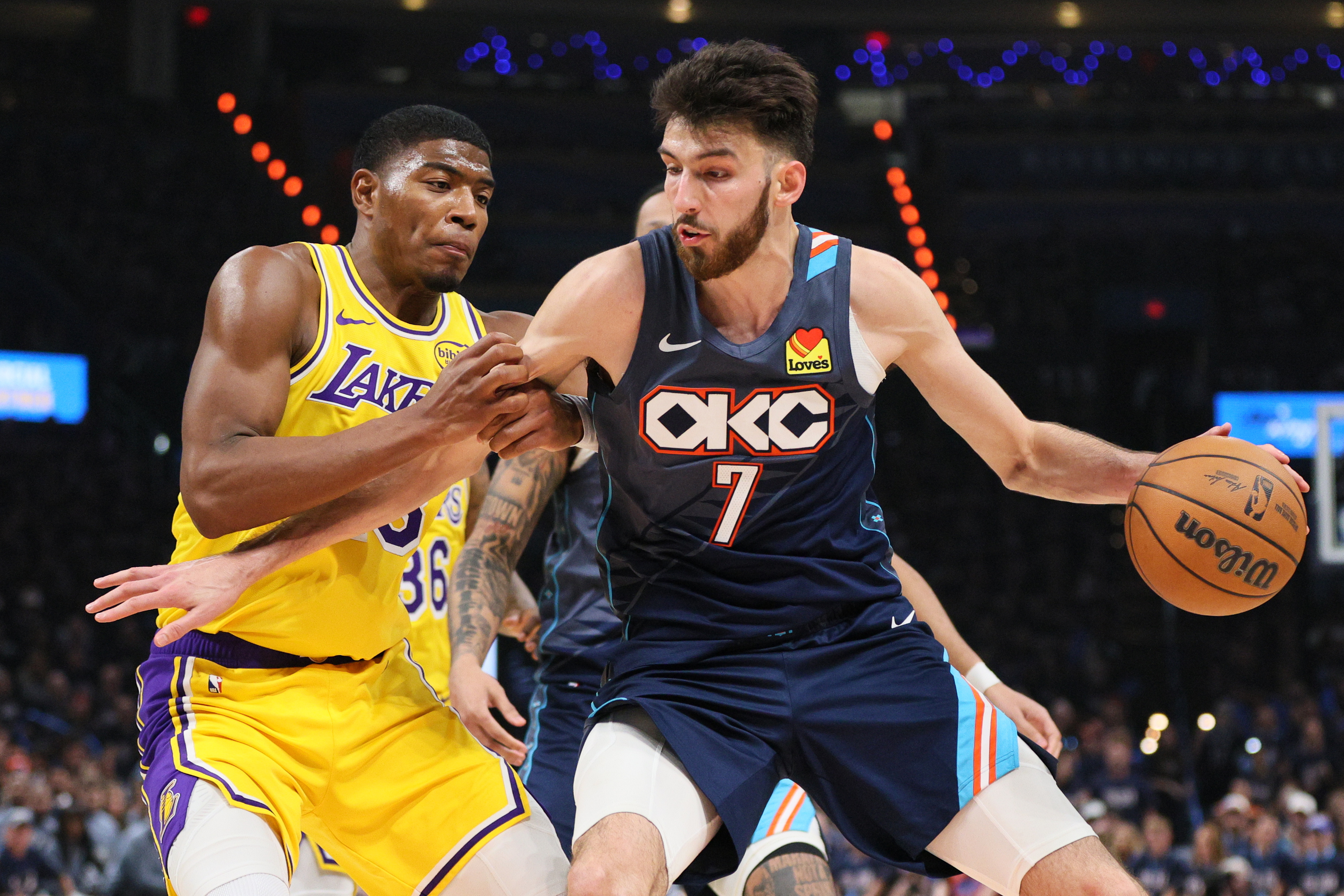 Oklahoma City Thunder center Chet Holmgren (7) works to the basket against Los Angeles Lakers forward Rui Hachimura (28) in the second half of Game 2 in a second-round NBA basketball playoffs series Thursday, May 7, 2026, in Oklahoma City.