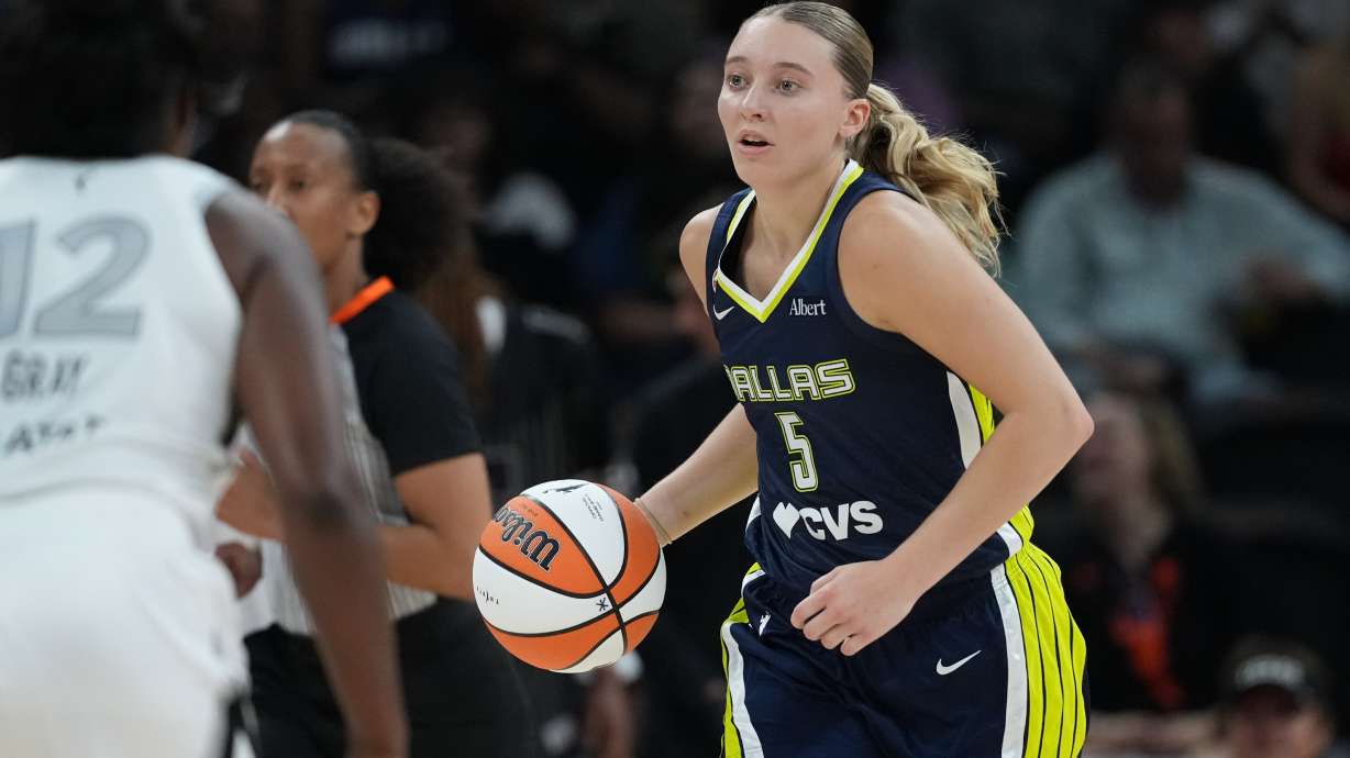 Dallas Wings guard Paige Bueckers (5) moves the ball up court against the Las Vegas Aces during the second half of a WNBA preseason basketball game in Austin, Texas, Sunday, May 3, 2026.