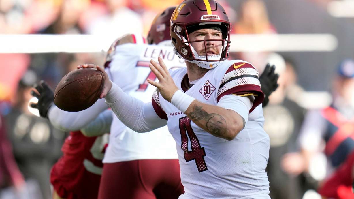 FILE - Washington Commanders quarterback Taylor Heinicke throws a pass in the first half of an NFL football game against the San Francisco 49ers, Dec. 24, 2022, in Santa Clara, Calif.