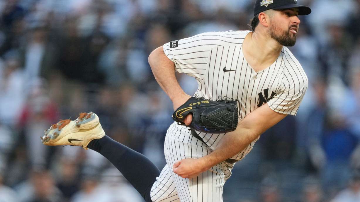 FILE - New York Yankees pitcher Carlos Rodón delivers against the Boston Red Sox during the first inning of Game 2 of an American League wild-card baseball playoff series, Oct. 1, 2025, in New York.
