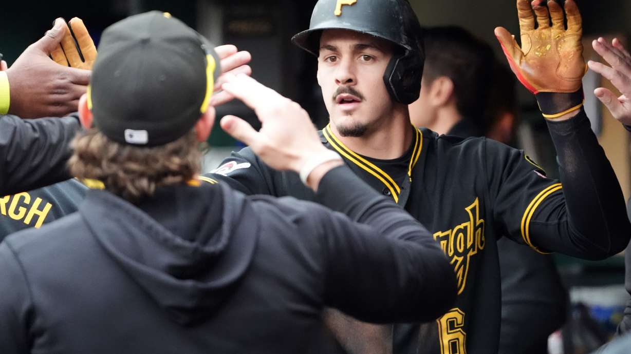 Pittsburgh Pirates' Konnor Griffin is greeted by his teammates after scoring on a single by Oneil Cruz against the Cincinnati Reds in the fourth inning of a baseball game in Pittsburgh, Saturday, May 2, 2026.